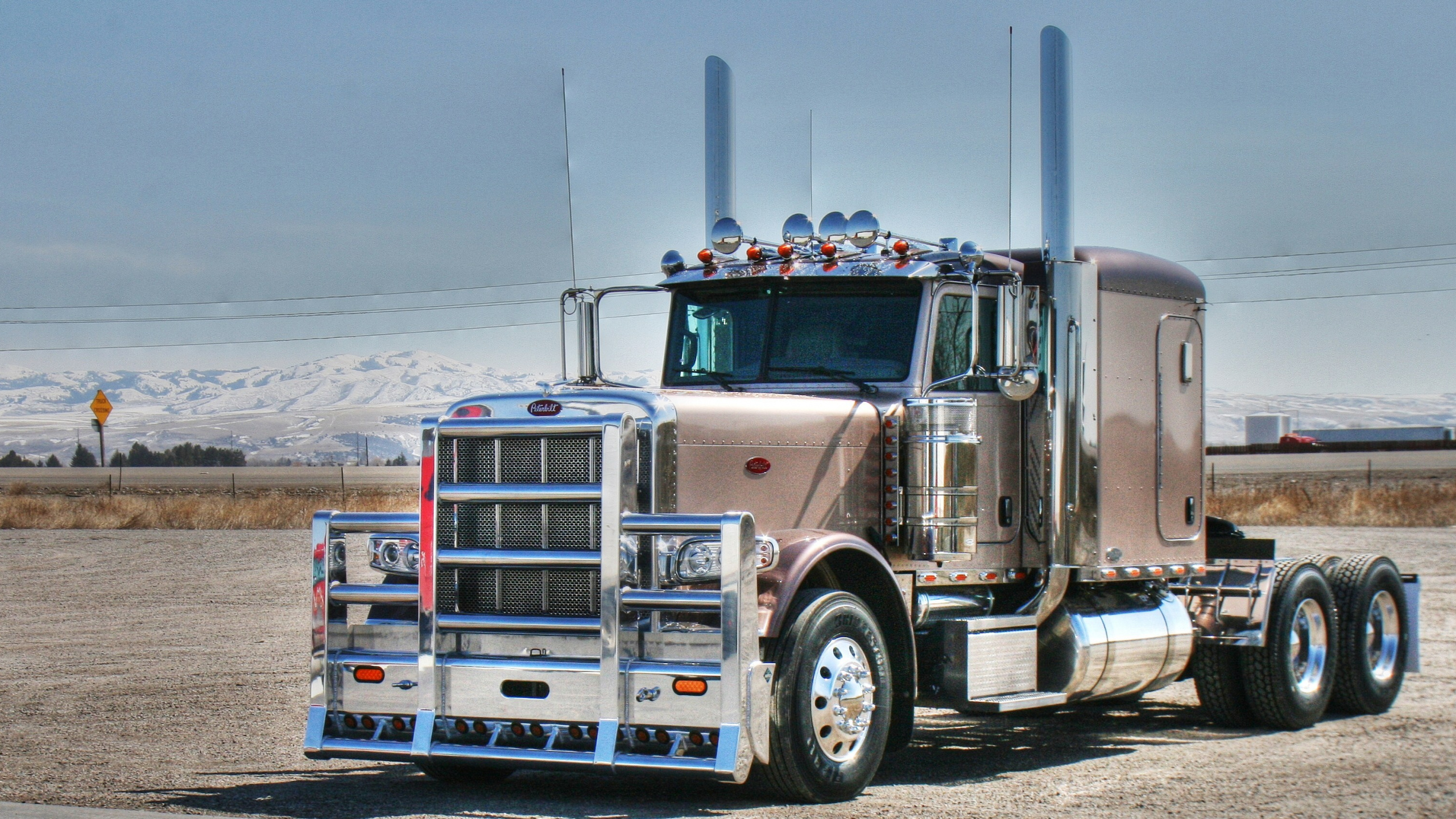 White and Red Truck on Snow Covered Ground During Daytime. Wallpaper in 2560x1440 Resolution