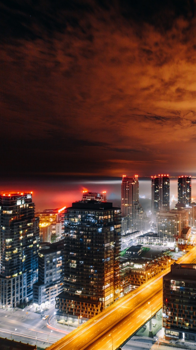 City Skyline During Night Time. Wallpaper in 750x1334 Resolution