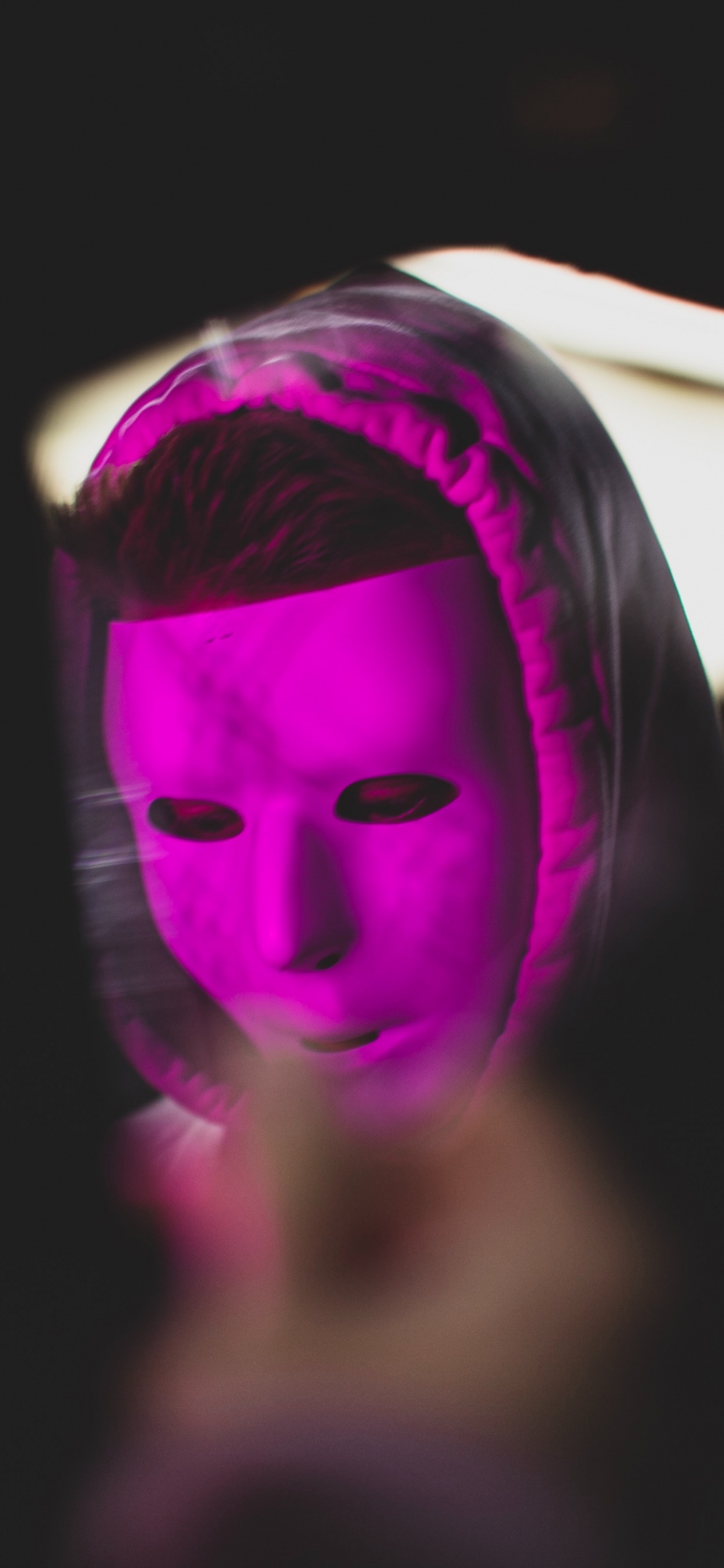 Woman With Purple and White Face Mask. Wallpaper in 1242x2688 Resolution