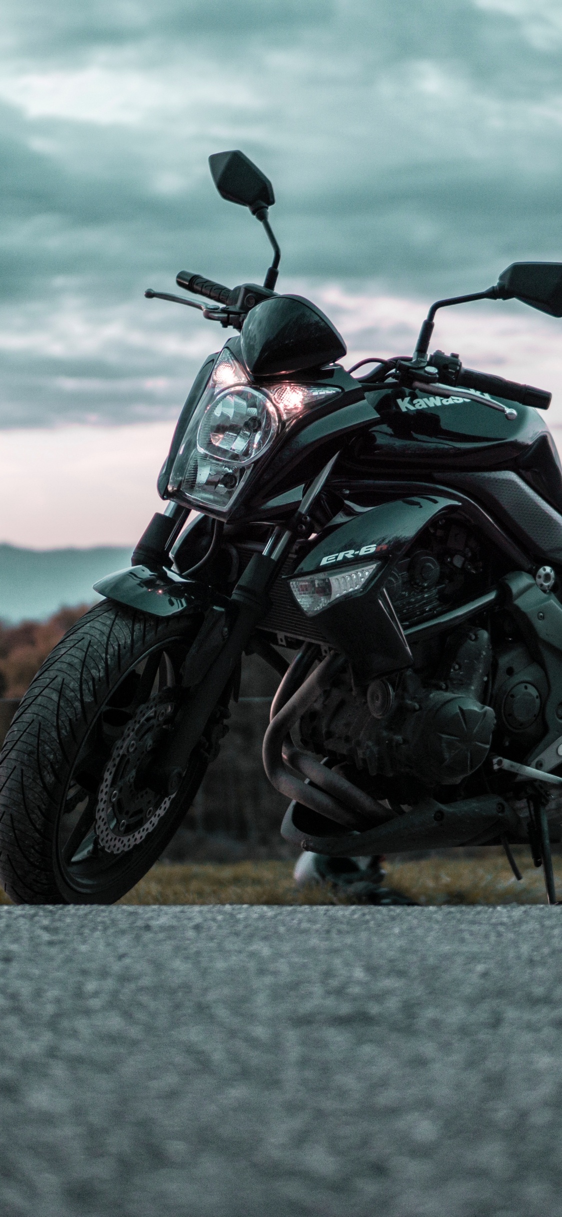 Black and Gray Motorcycle on Gray Asphalt Road During Daytime. Wallpaper in 1125x2436 Resolution