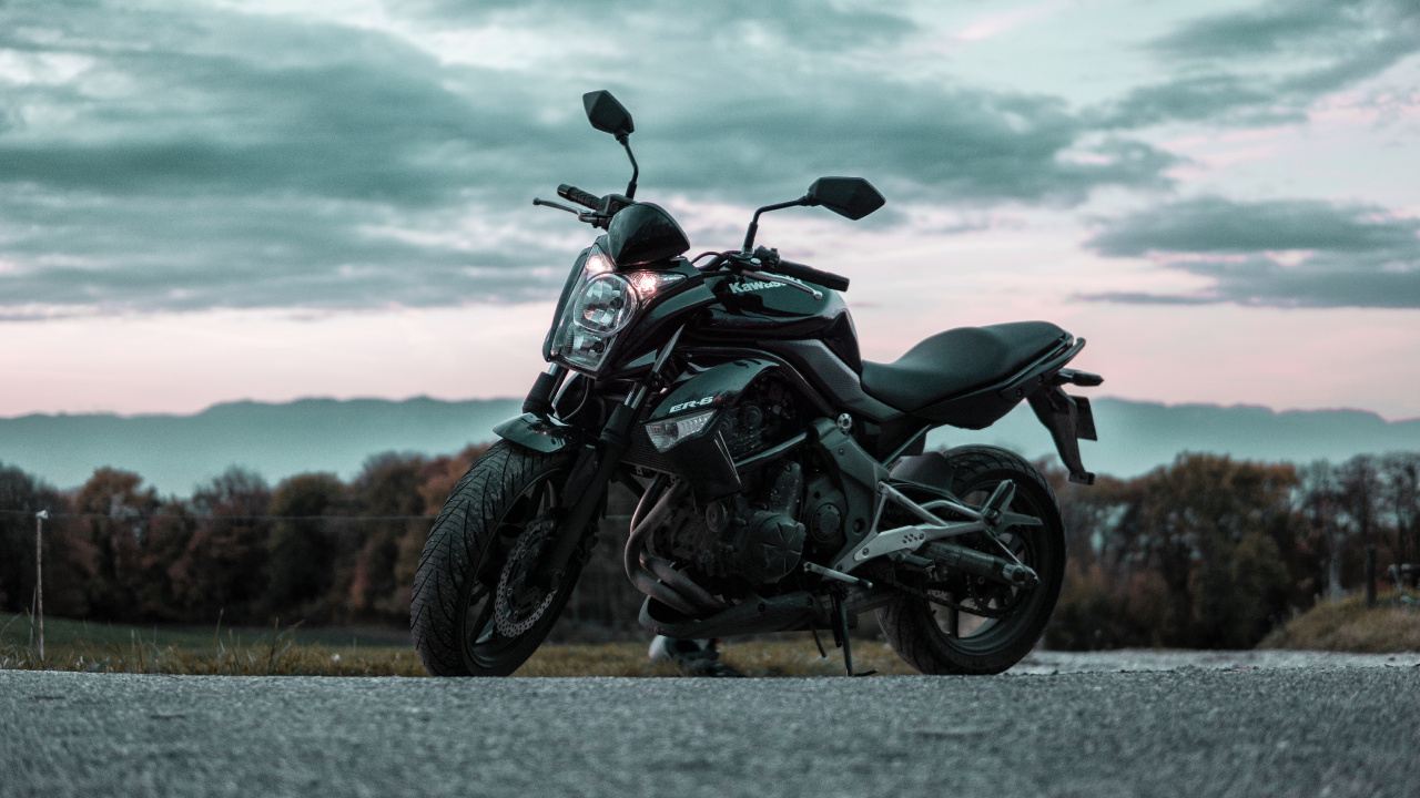 Black and Gray Motorcycle on Gray Asphalt Road During Daytime. Wallpaper in 1280x720 Resolution