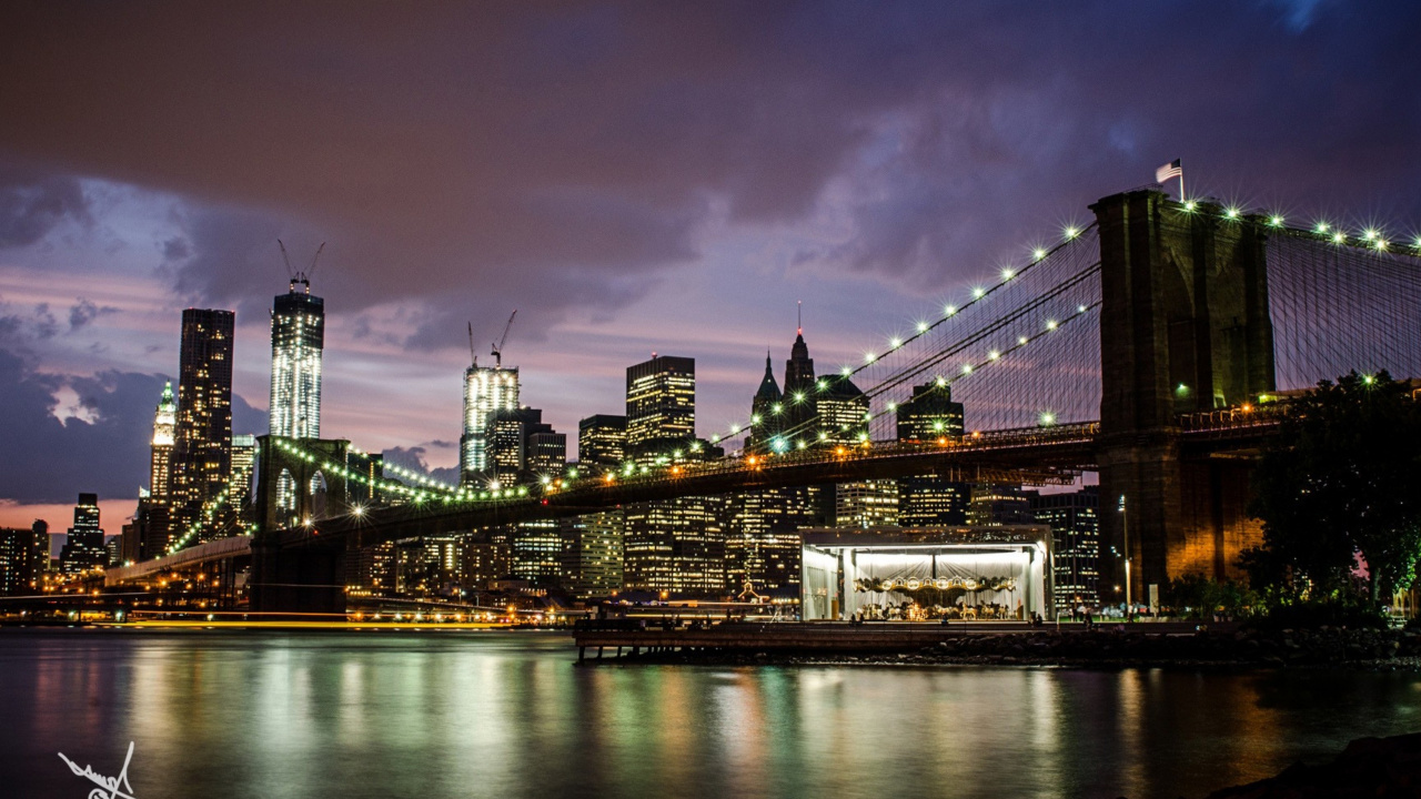 Lighted Bridge Over River During Night Time. Wallpaper in 1280x720 Resolution
