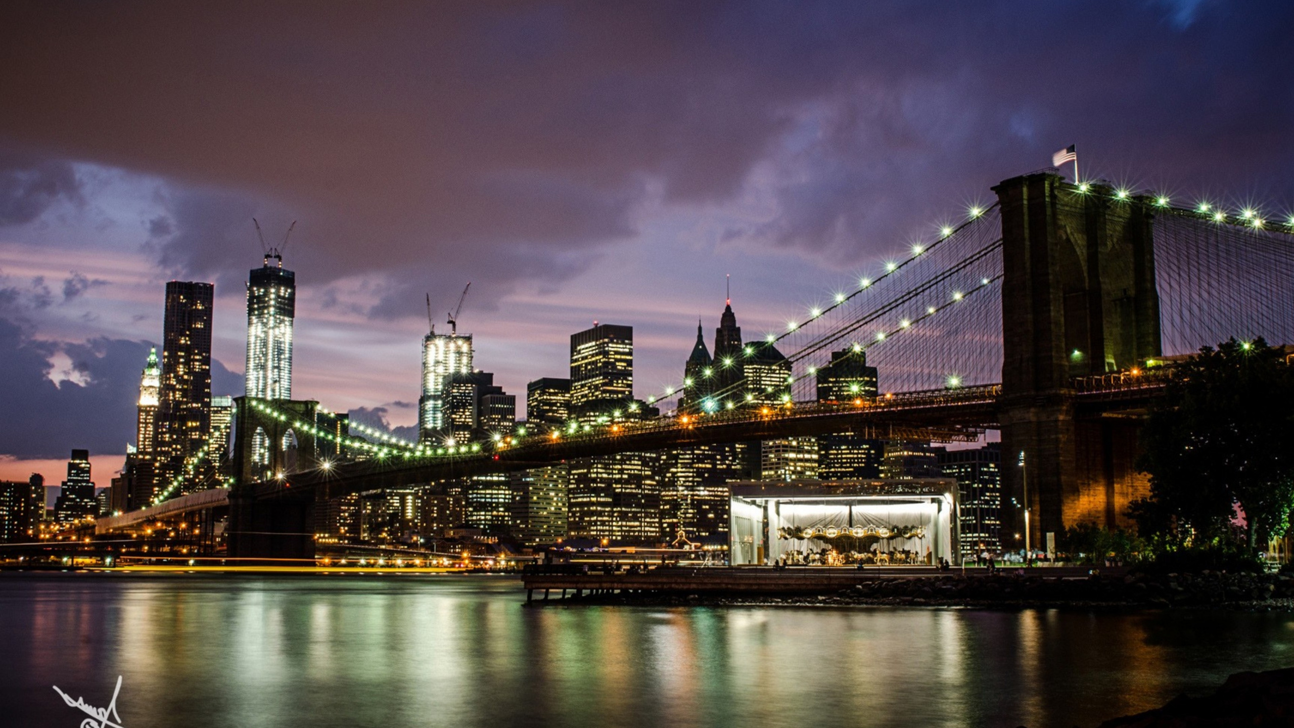Lighted Bridge Over River During Night Time. Wallpaper in 2560x1440 Resolution