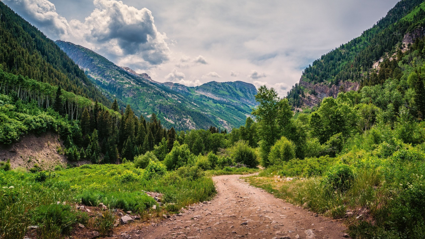 Green Trees and Mountain Under White Clouds and Blue Sky During Daytime. Wallpaper in 1366x768 Resolution