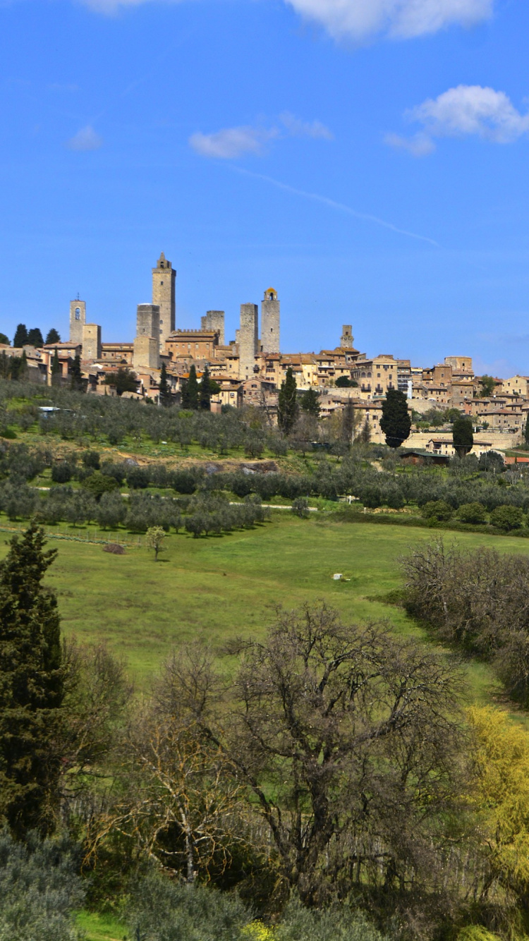Bâtiment en Béton Brun Sous Ciel Bleu Pendant la Journée. Wallpaper in 750x1334 Resolution