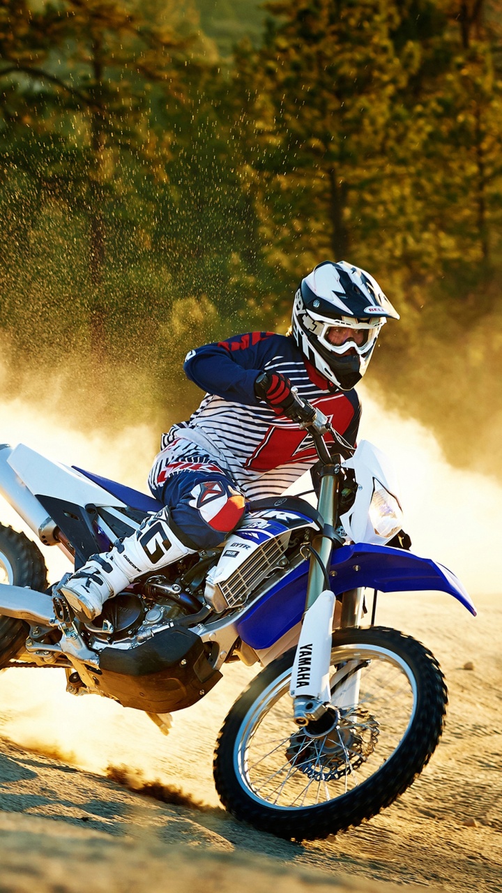 Man Riding Motocross Dirt Bike on Dirt Road During Daytime. Wallpaper in 720x1280 Resolution