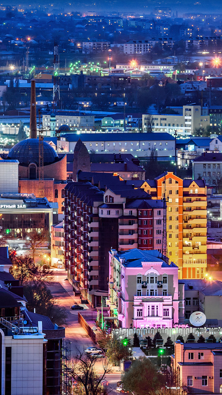 Vue Aérienne Des Bâtiments de la Ville Pendant la Nuit. Wallpaper in 750x1334 Resolution