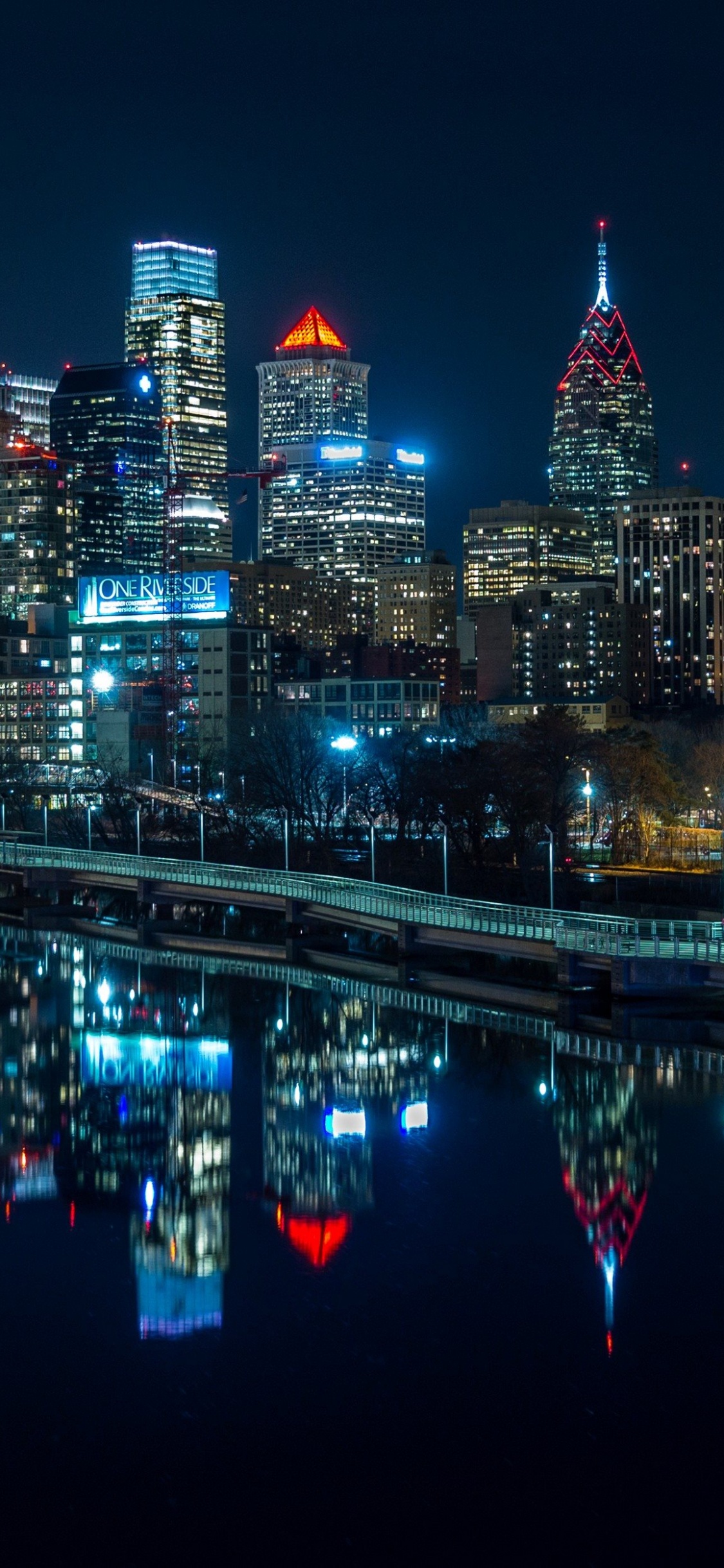 City Skyline During Night Time. Wallpaper in 1125x2436 Resolution