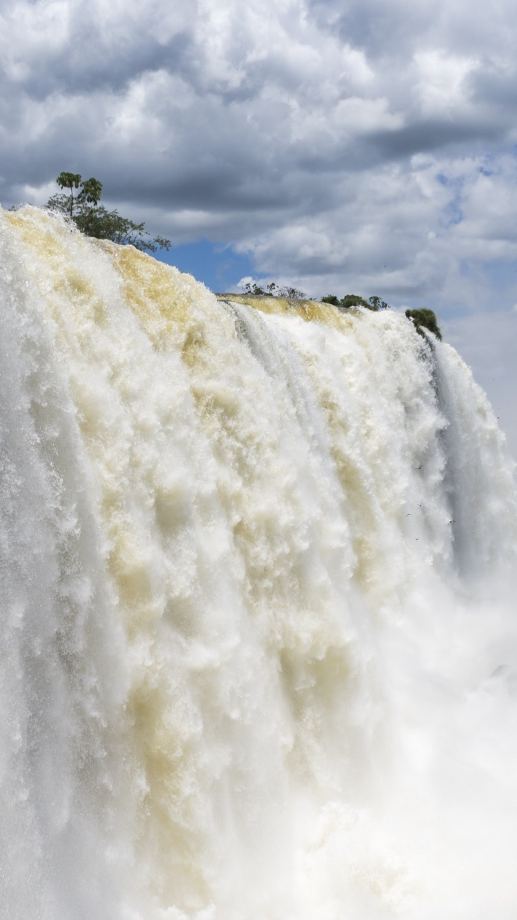 Waterfalls Under Cloudy Sky During Daytime. Wallpaper in 750x1334 Resolution