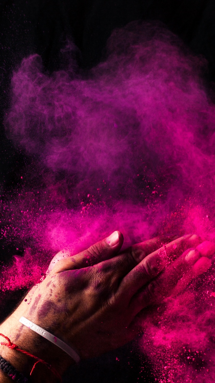 Person Holding Purple Powder in The Dark. Wallpaper in 720x1280 Resolution