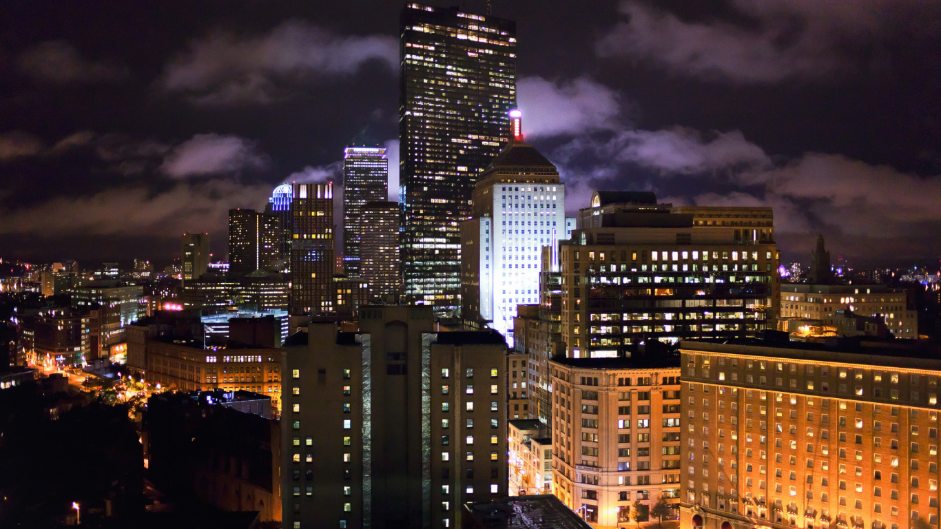 City Buildings Under Dark Cloudy Sky During Night Time. Wallpaper in 1366x768 Resolution