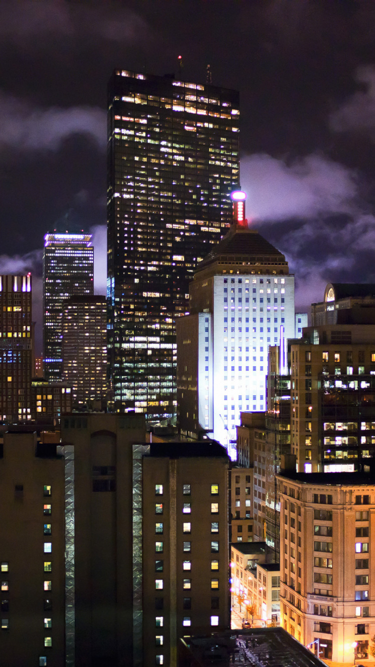 City Buildings Under Dark Cloudy Sky During Night Time. Wallpaper in 750x1334 Resolution