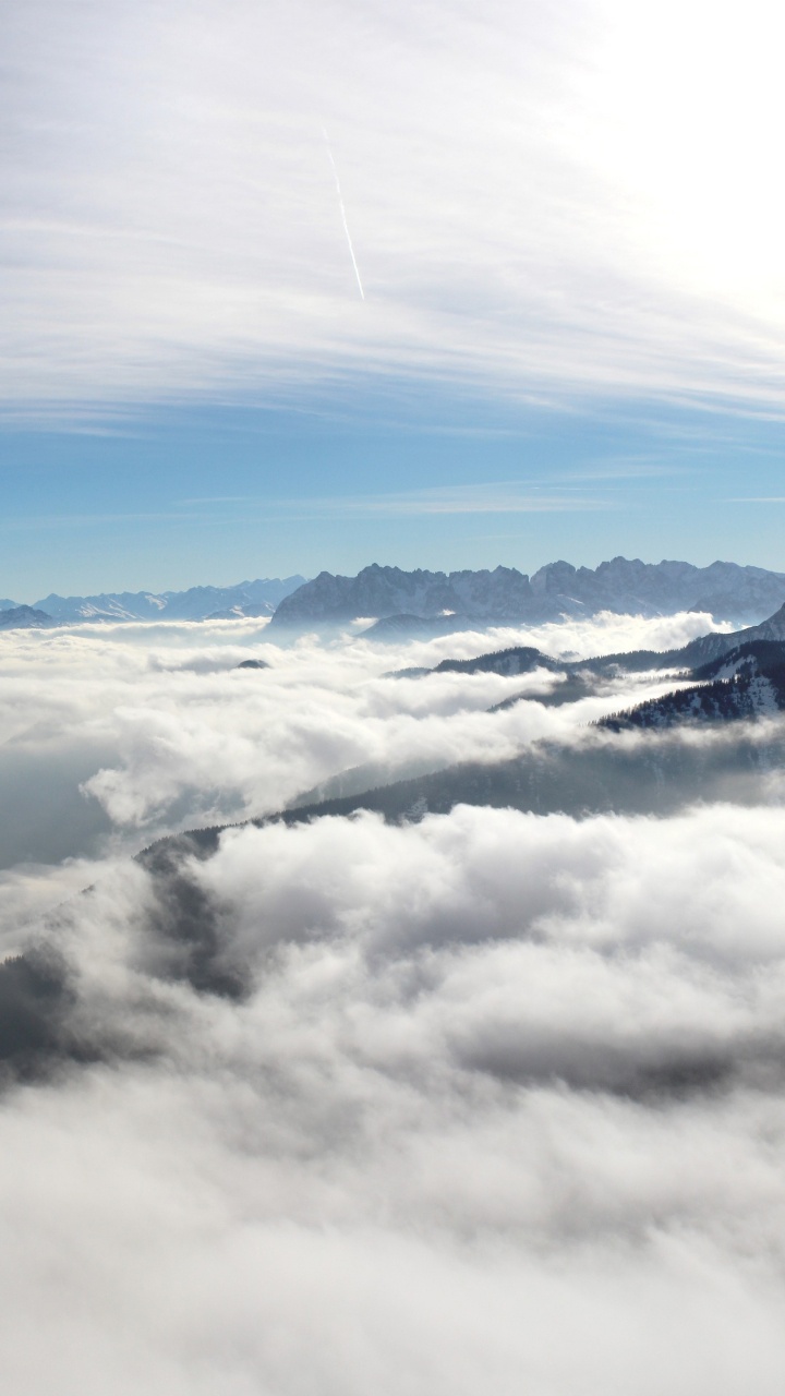 White Clouds Over Snow Covered Mountains. Wallpaper in 720x1280 Resolution