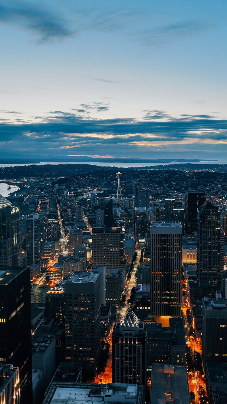 Aerial View of City Buildings During Night Time. Wallpaper in 750x1334 Resolution