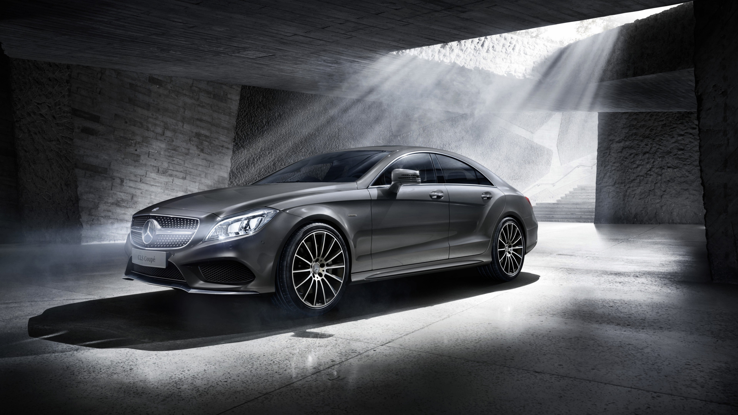 Silver Mercedes Benz Coupe Parked Beside Gray Concrete Wall. Wallpaper in 2560x1440 Resolution
