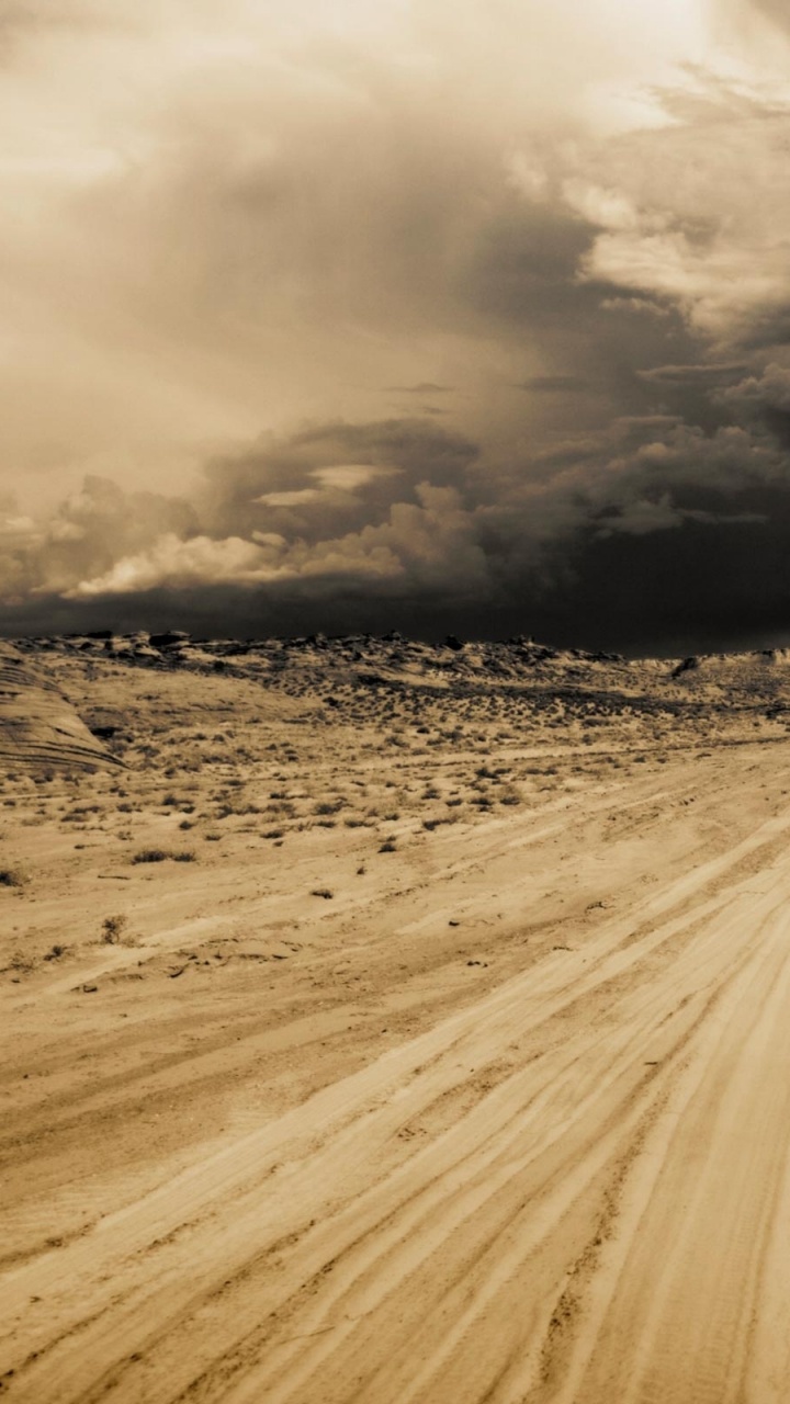 White Car on Brown Sand Under Cloudy Sky During Daytime. Wallpaper in 720x1280 Resolution