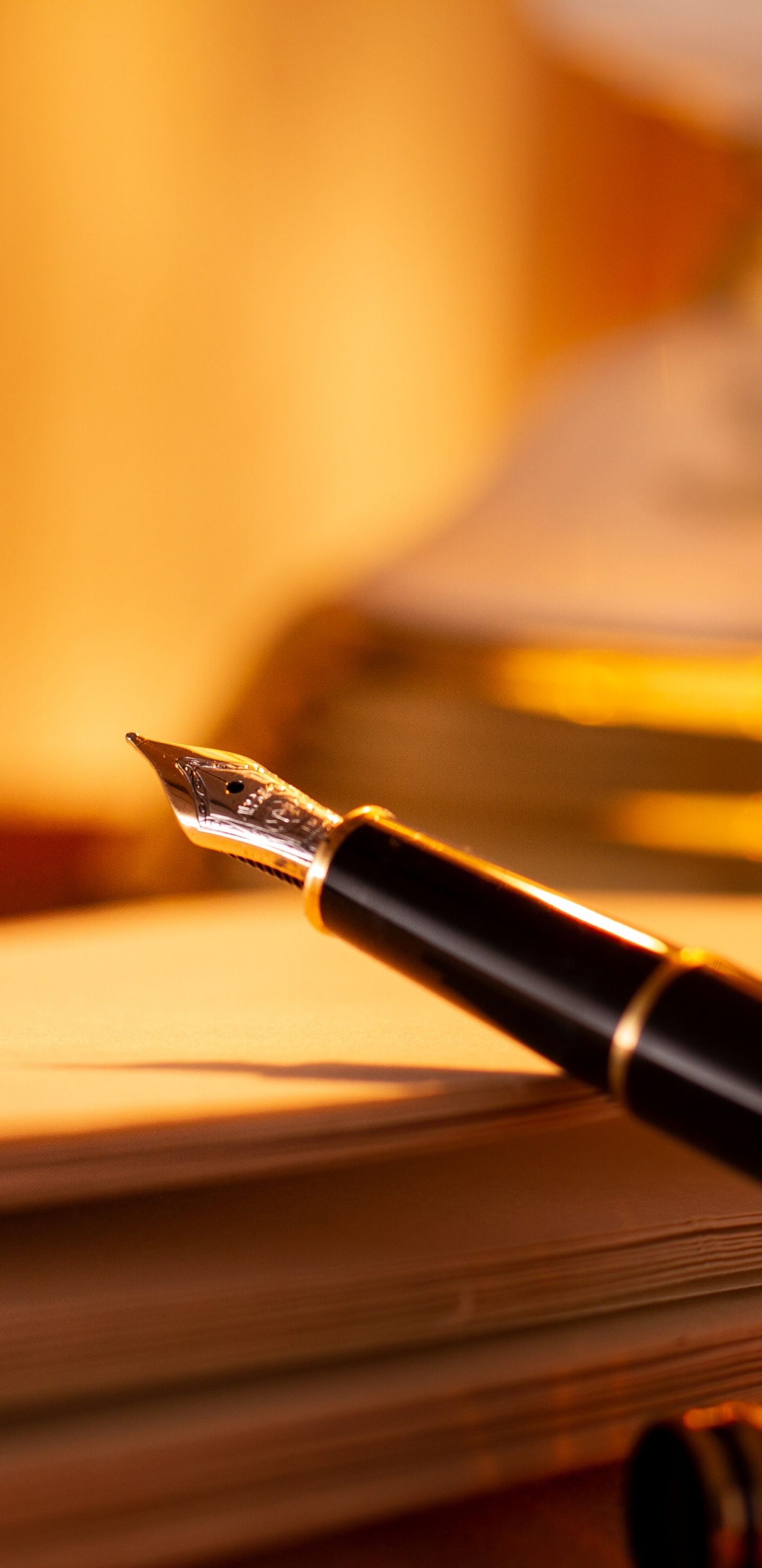 Black and Gold Fountain Pen on Brown Wooden Table. Wallpaper in 1440x2960 Resolution