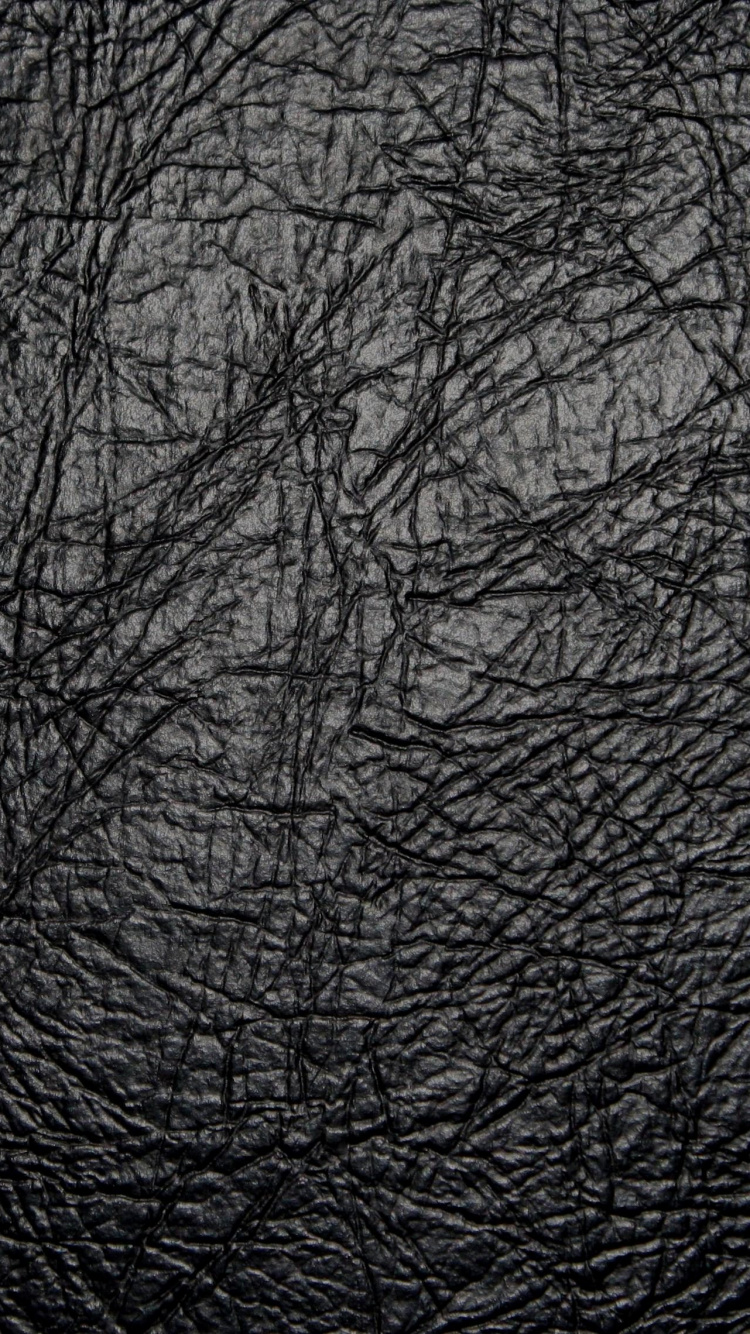 Schwarzes Ledertextil in Nahaufnahmen. Wallpaper in 750x1334 Resolution