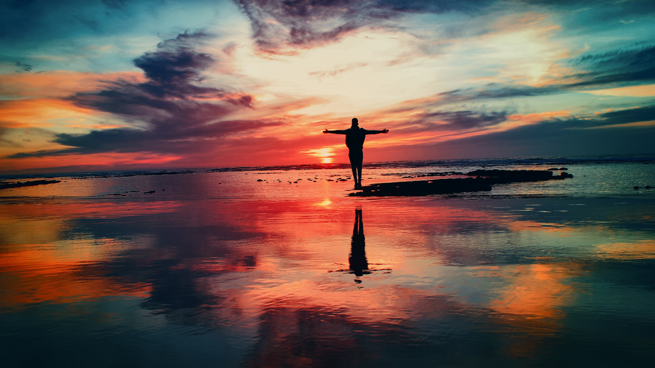 Silhouette of Person Standing on Seashore During Sunset. Wallpaper in 1280x720 Resolution