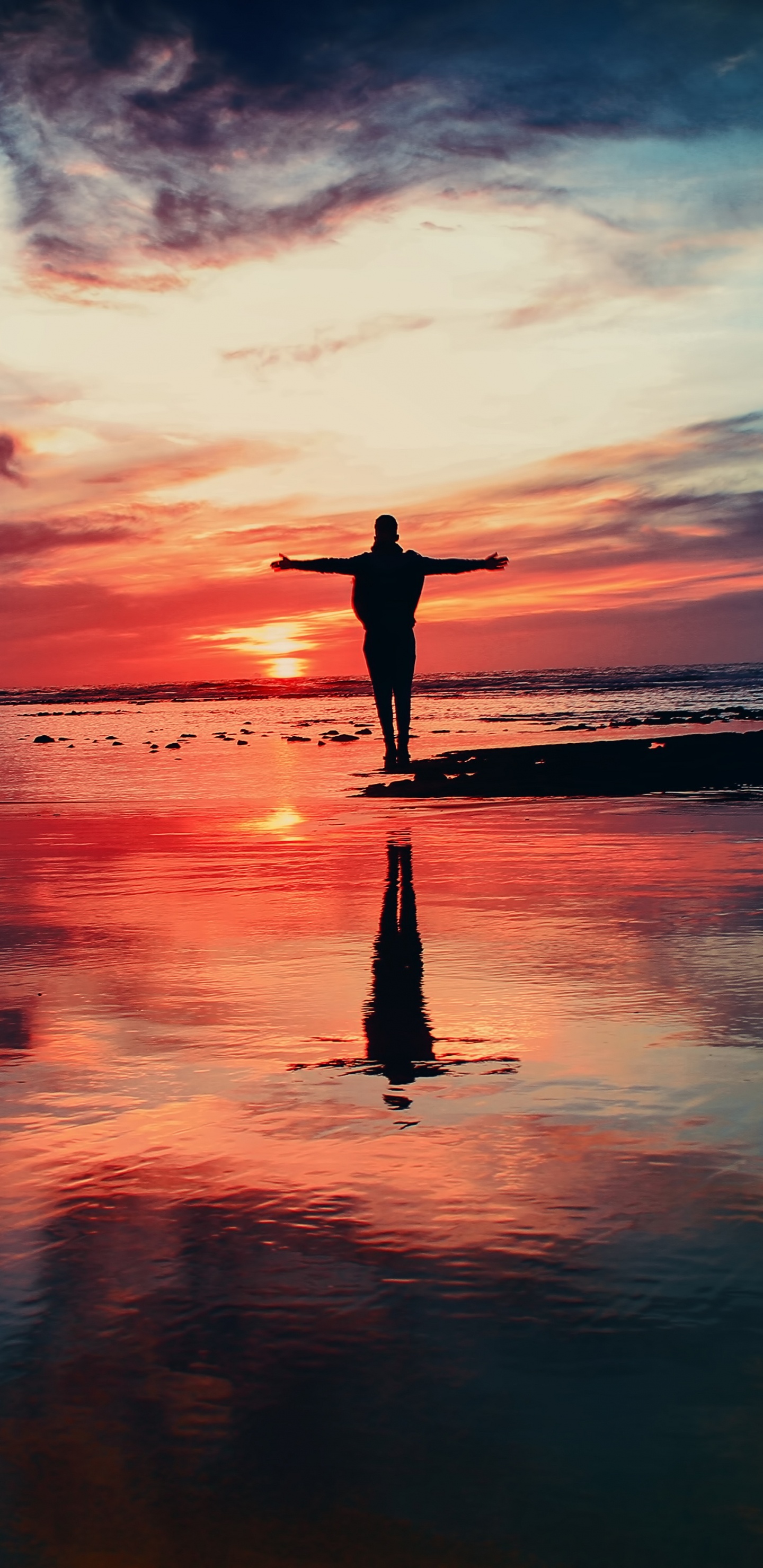 Silhouette of Person Standing on Seashore During Sunset. Wallpaper in 1440x2960 Resolution