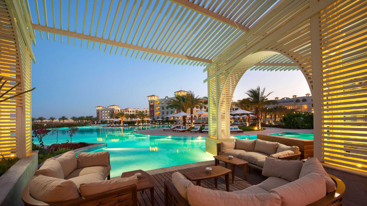 Brown Wicker Armchairs Near Swimming Pool During Daytime. Wallpaper in 1280x720 Resolution