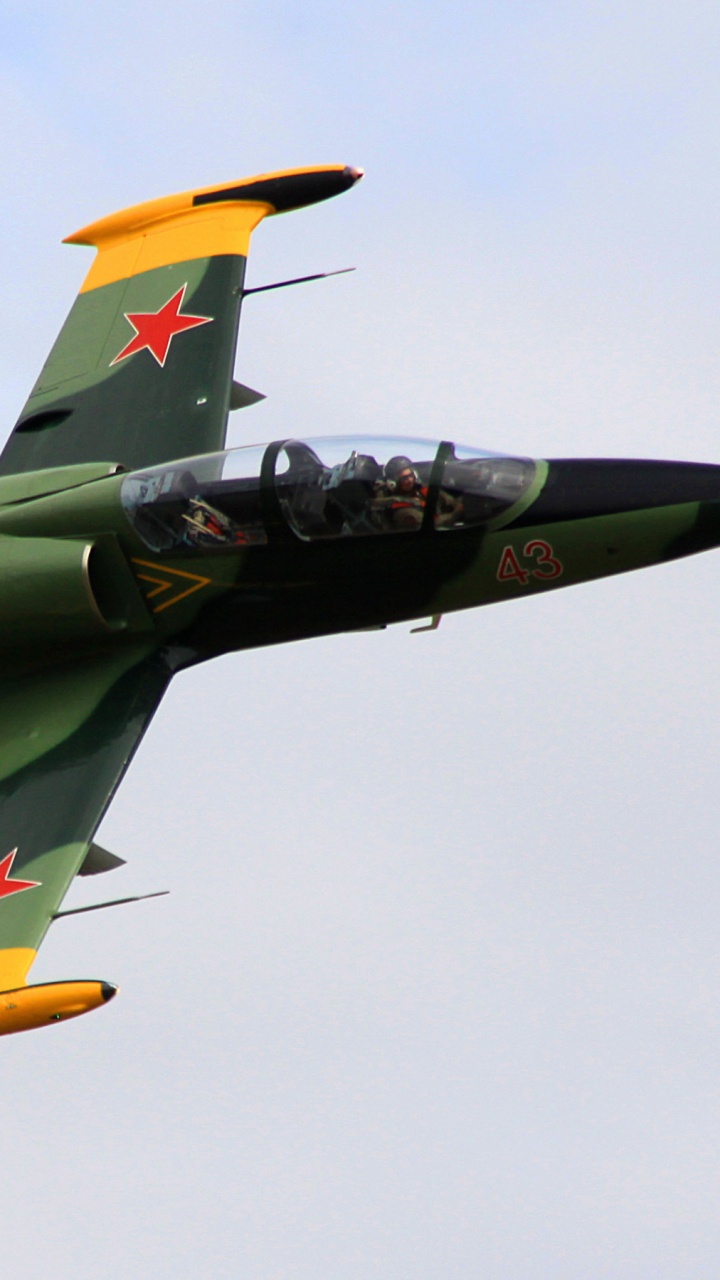 Black and Yellow Jet Plane in Mid Air. Wallpaper in 720x1280 Resolution