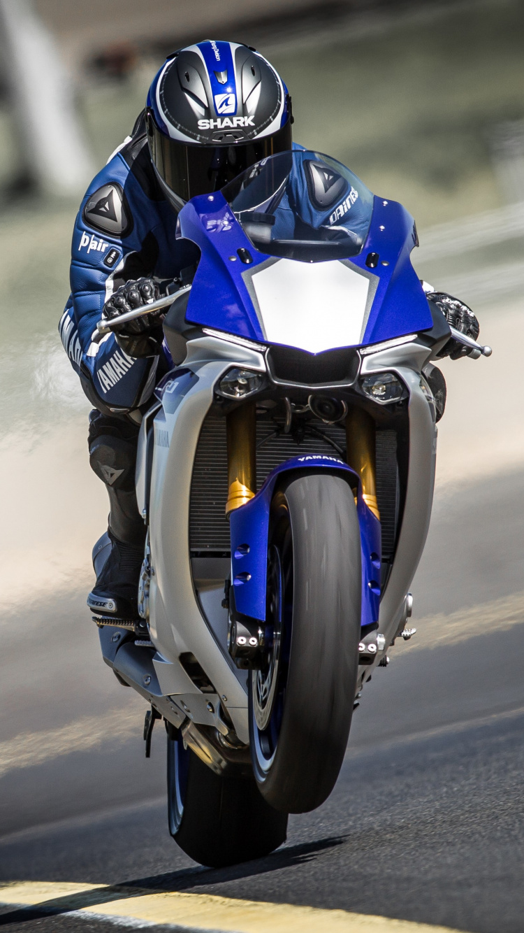 Man in Blue and Black Motorcycle Helmet Riding on Blue Motorcycle. Wallpaper in 750x1334 Resolution