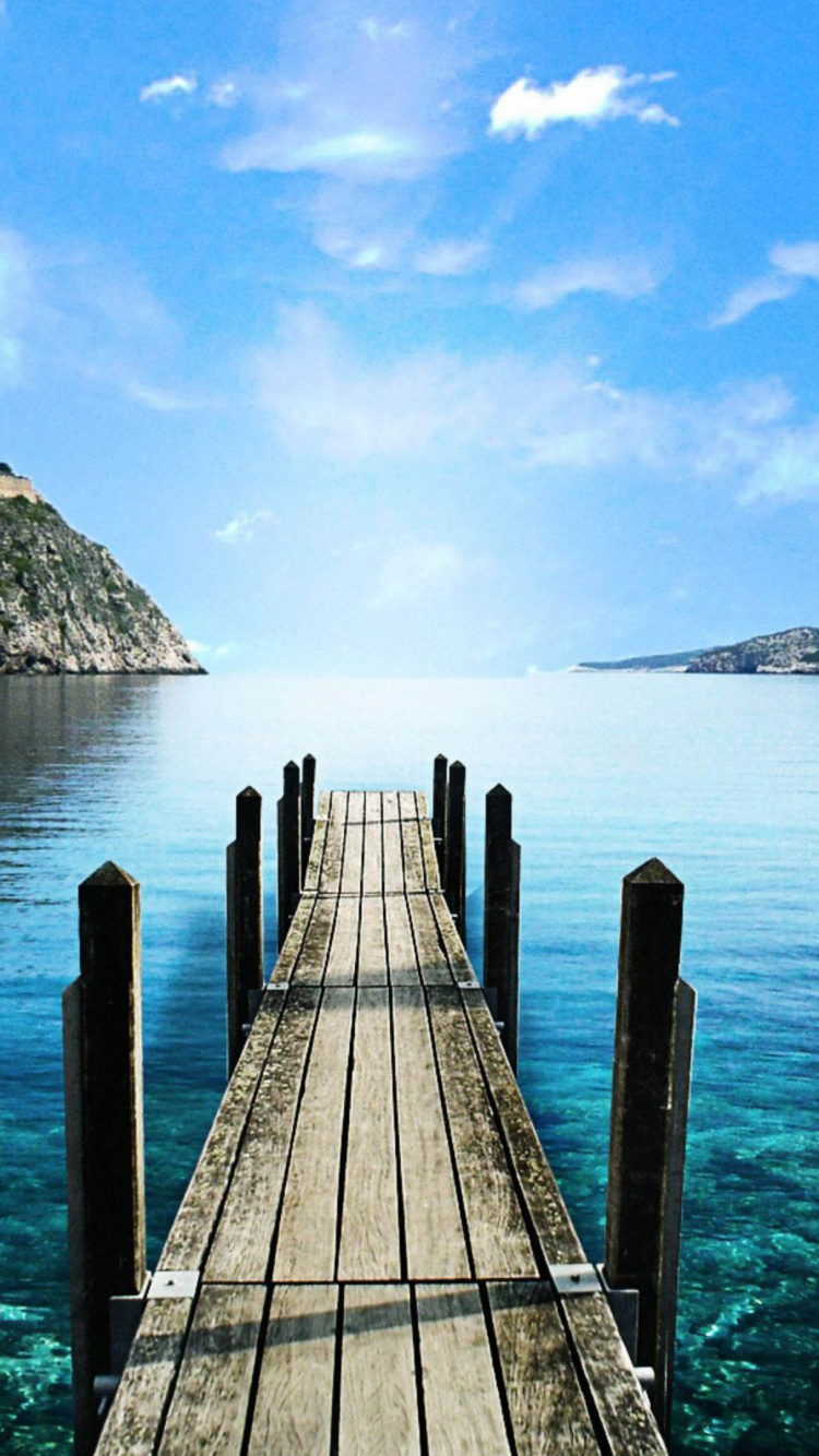 Brown Wooden Dock on Body of Water During Daytime. Wallpaper in 750x1334 Resolution