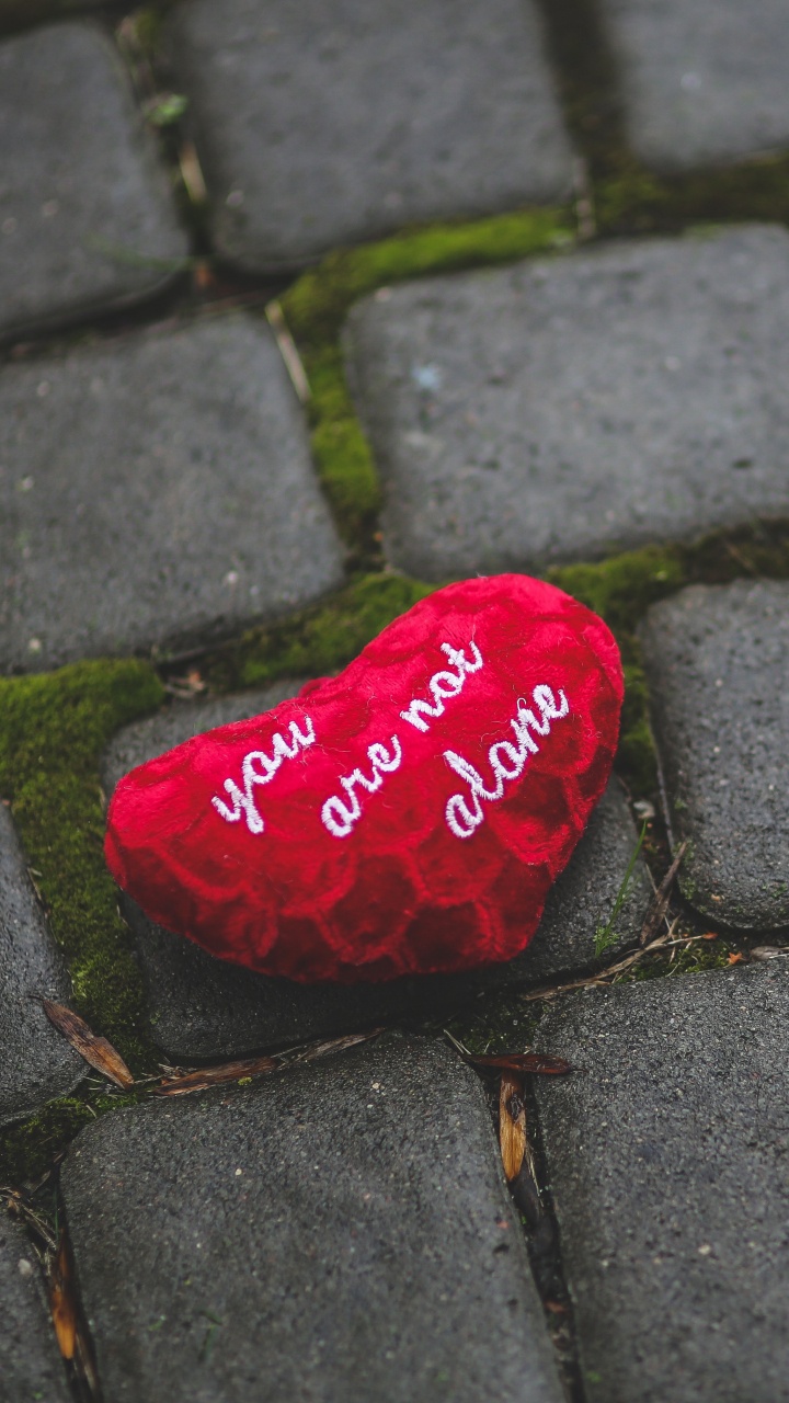 Red Heart Shaped Ornament on Gray Concrete Floor. Wallpaper in 720x1280 Resolution
