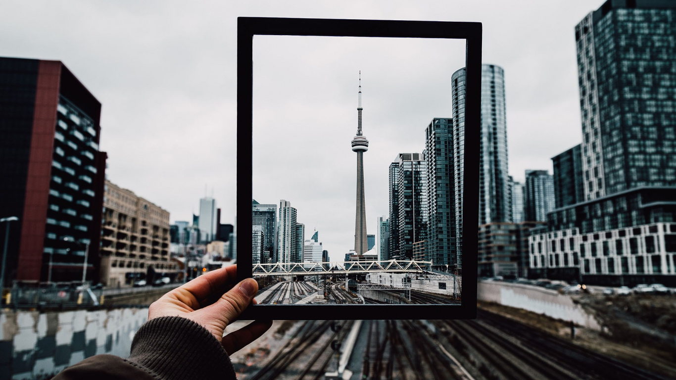 Person Holding Black Rectangular Frame. Wallpaper in 1366x768 Resolution