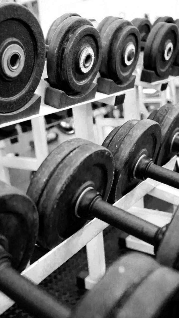 Black Dumbbell on White Wooden Rack. Wallpaper in 720x1280 Resolution