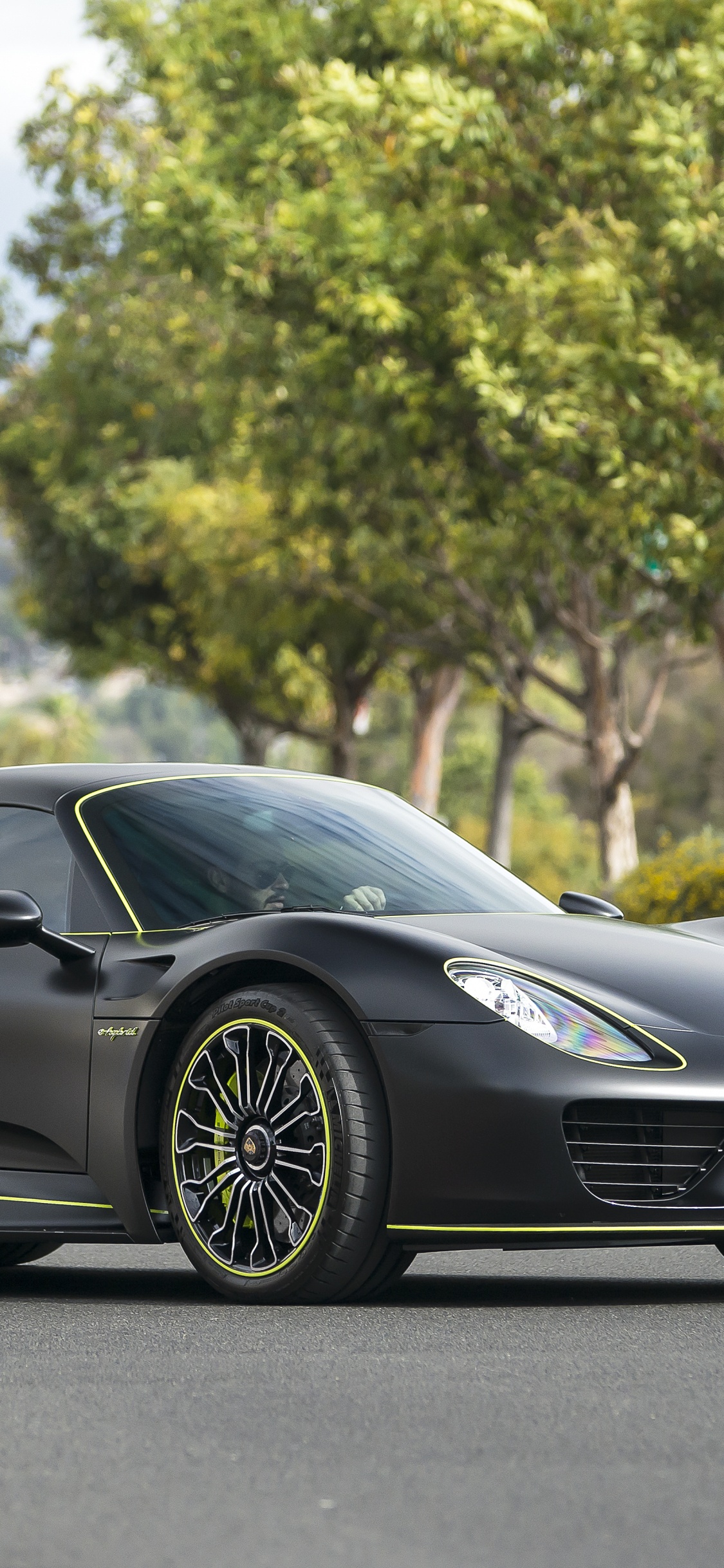 Black Porsche 911 on Road During Daytime. Wallpaper in 1125x2436 Resolution
