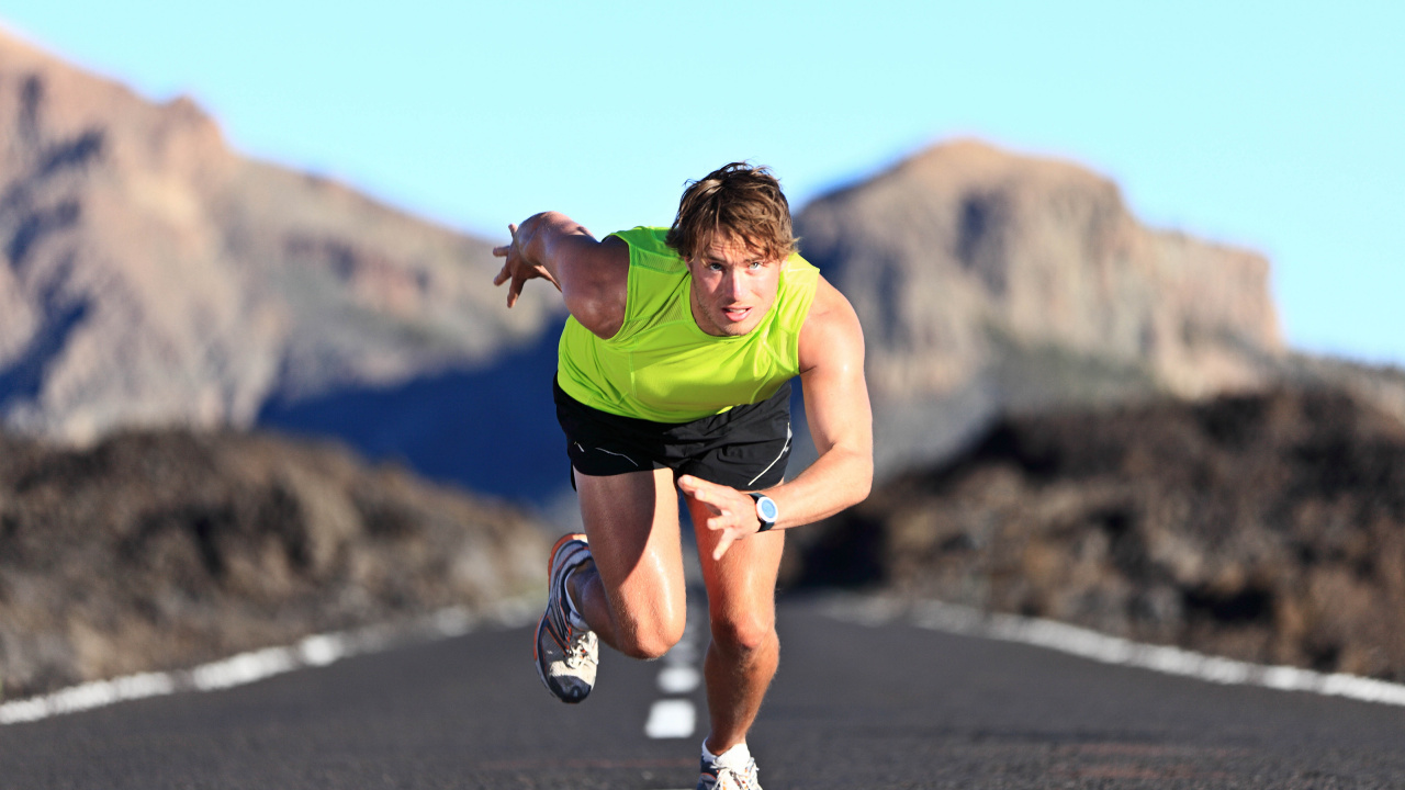 Man in Green Shirt Running on Road During Daytime. Wallpaper in 1280x720 Resolution