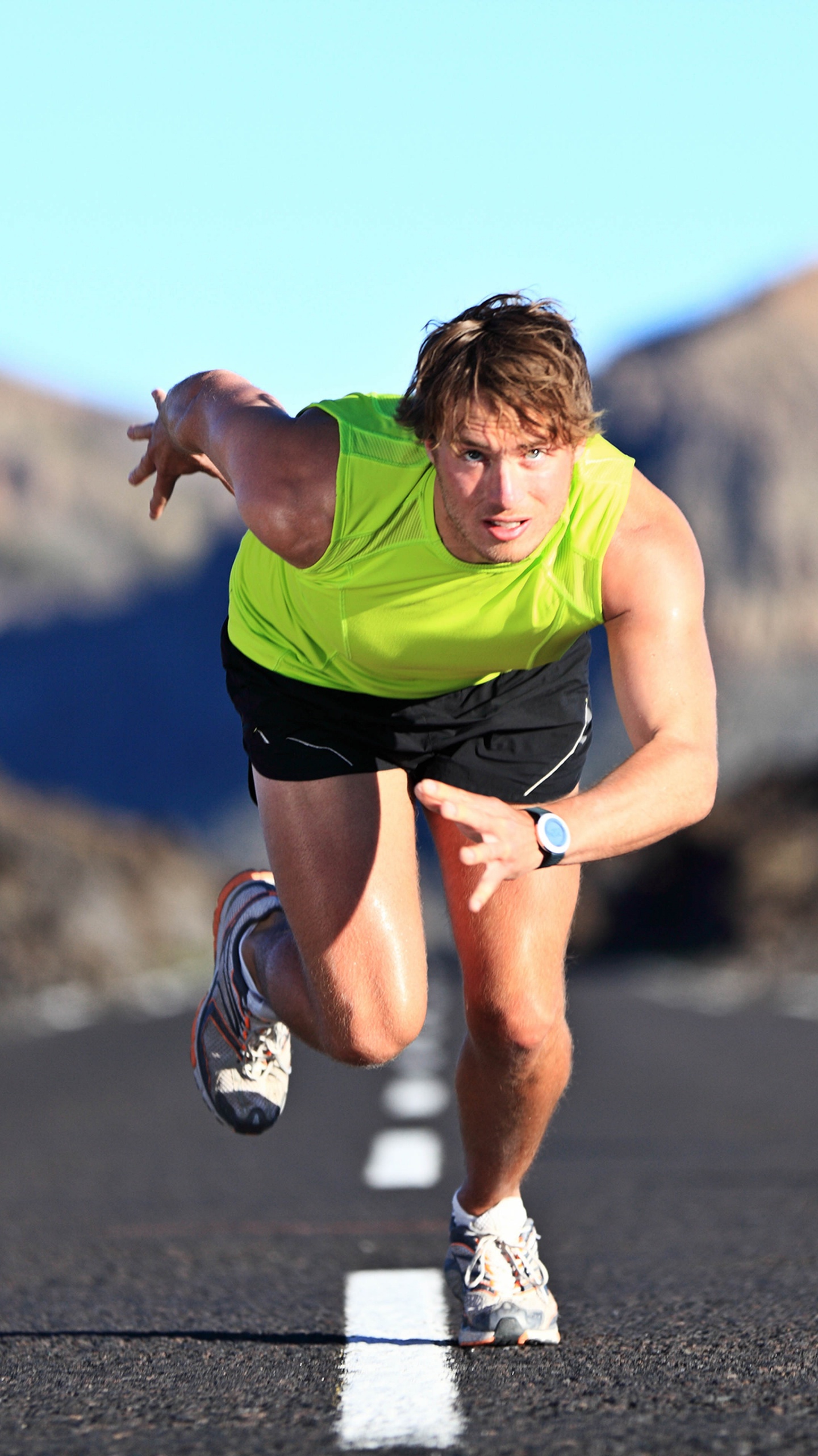 Man in Green Shirt Running on Road During Daytime. Wallpaper in 1440x2560 Resolution