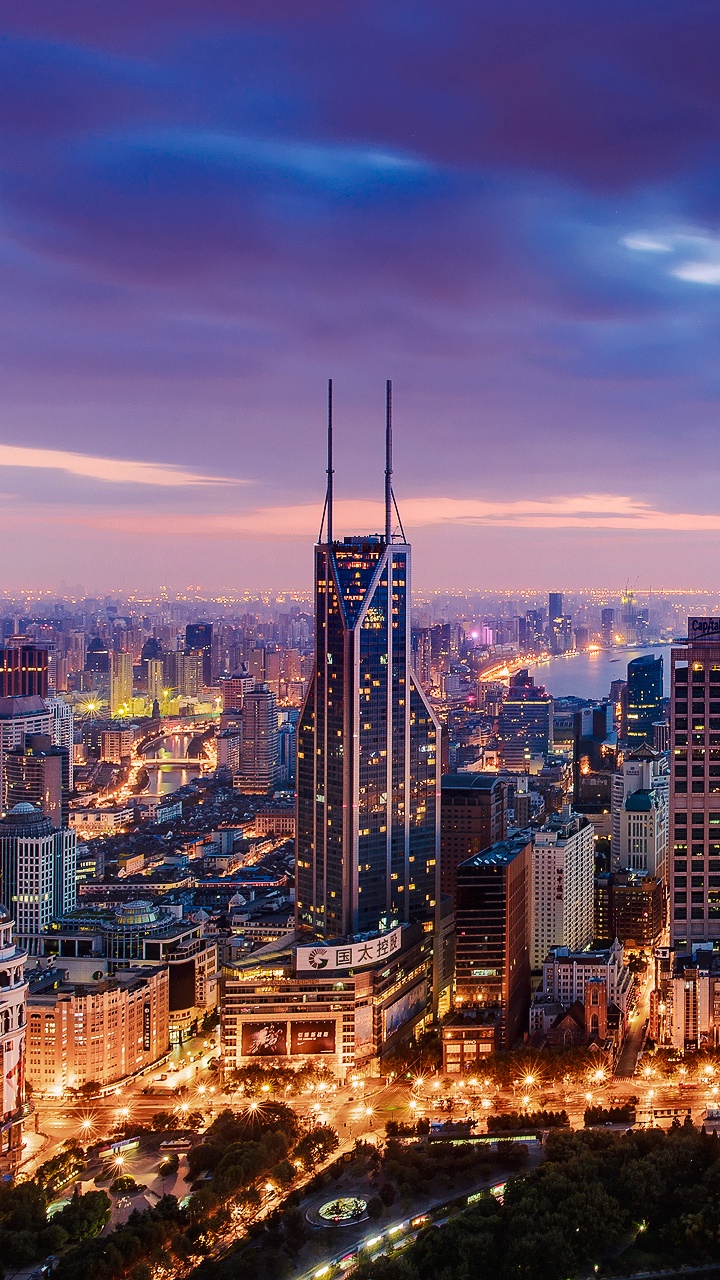 City Skyline During Night Time. Wallpaper in 720x1280 Resolution