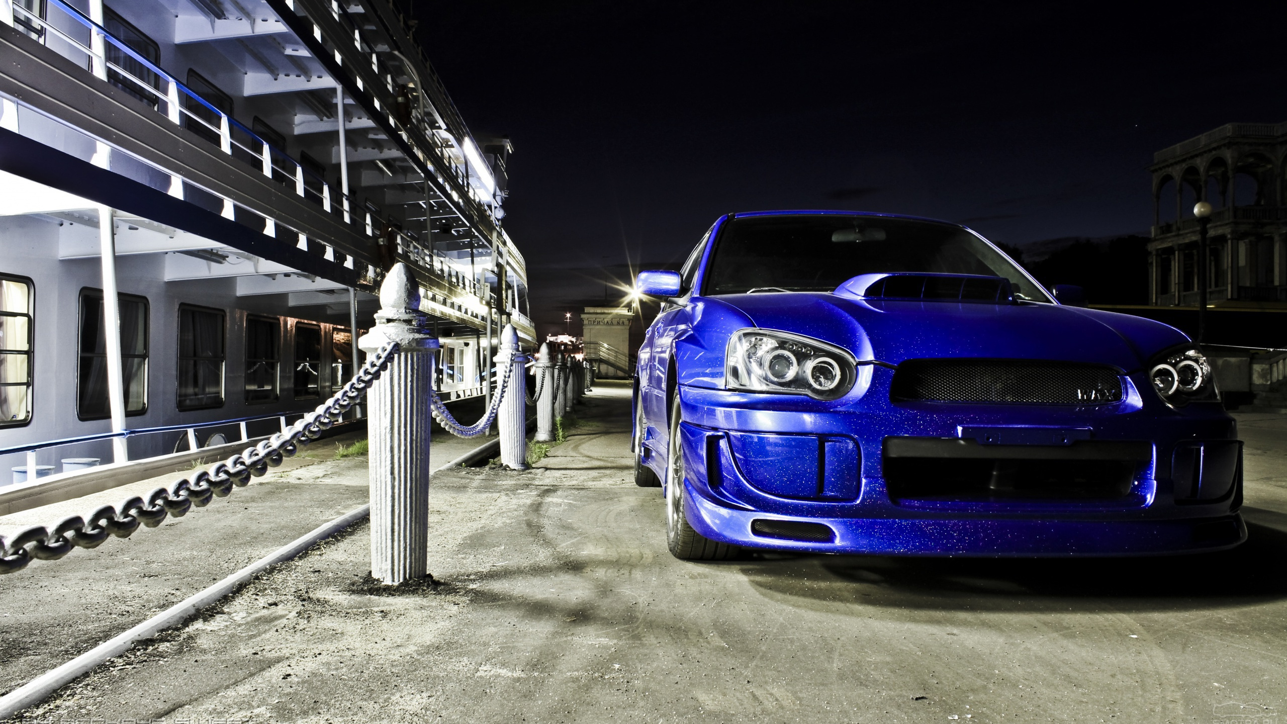 Blue Bmw m 3 Parked on Parking Lot During Night Time. Wallpaper in 2560x1440 Resolution