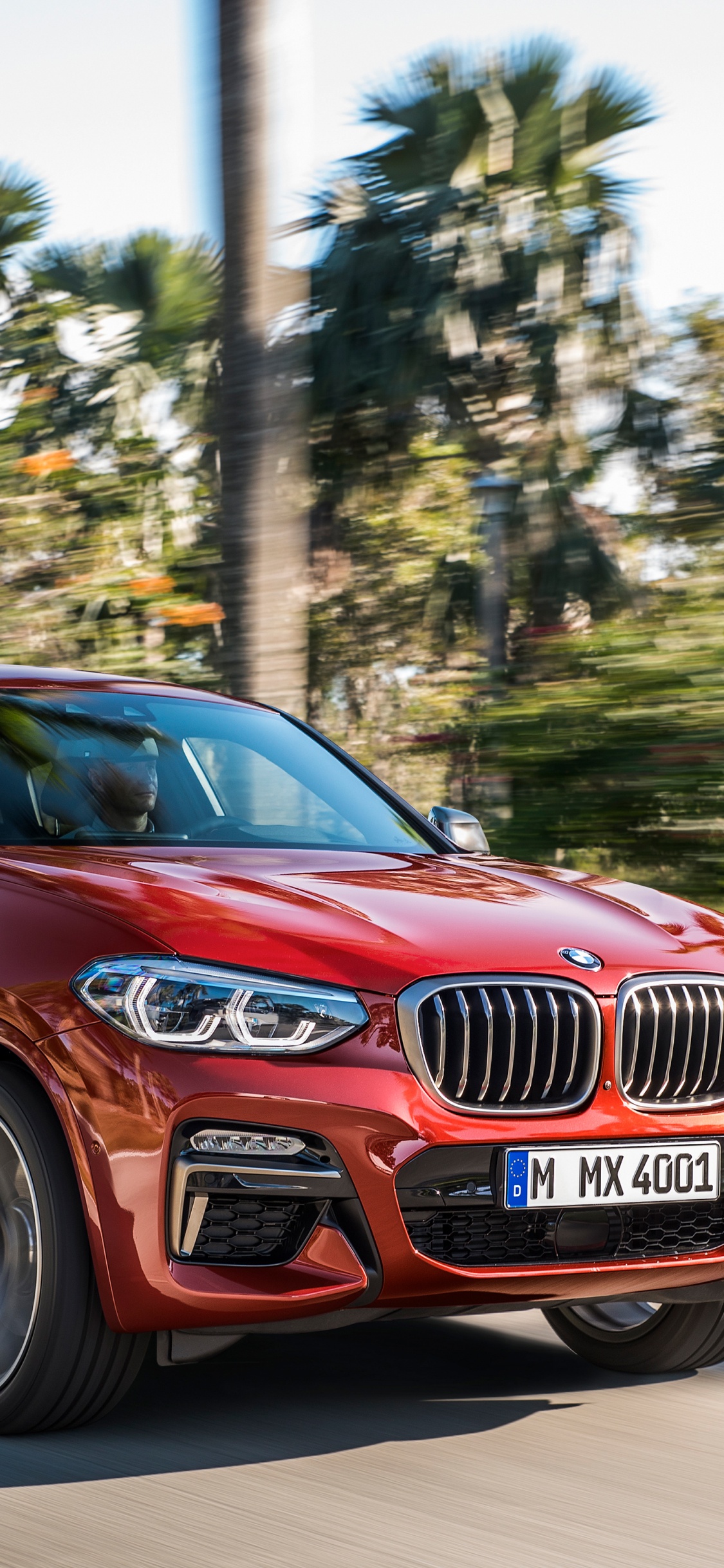 Red Honda Car on Road During Daytime. Wallpaper in 1125x2436 Resolution