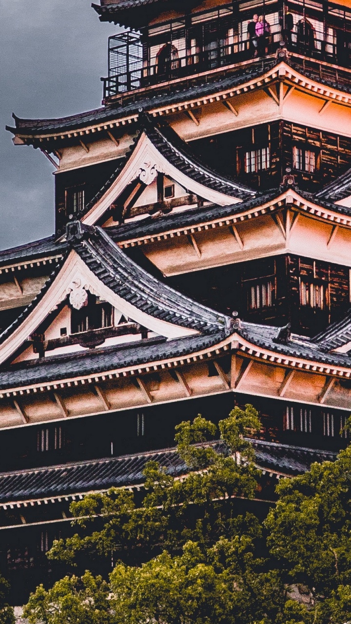 Black and White Temple Surrounded by Green Trees Under Gray Sky. Wallpaper in 720x1280 Resolution