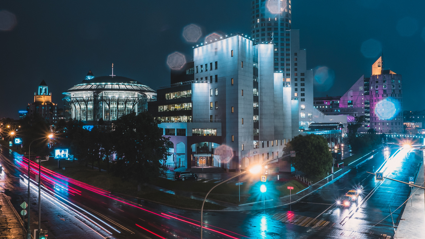 Cars on Road Near City Buildings During Night Time. Wallpaper in 1366x768 Resolution
