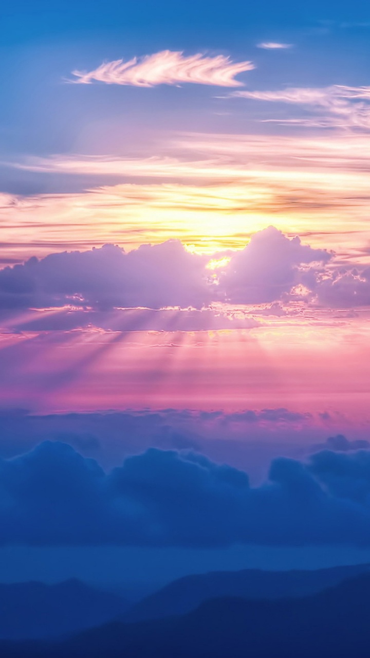 Clouds and Mountains During Sunset. Wallpaper in 720x1280 Resolution