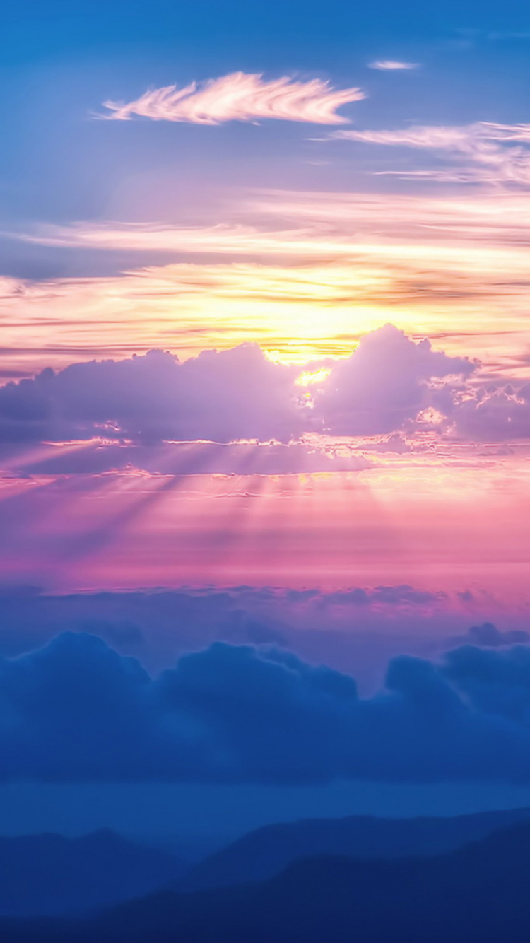 Clouds and Mountains During Sunset. Wallpaper in 750x1334 Resolution