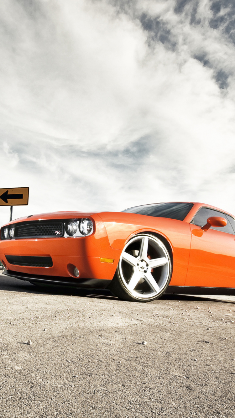 Orange Porsche 911 on Gray Asphalt Road Under White Clouds During Daytime. Wallpaper in 750x1334 Resolution