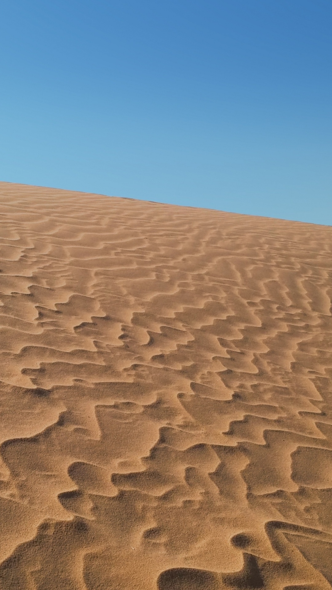 Brown Sand Under Blue Sky During Daytime. Wallpaper in 1080x1920 Resolution