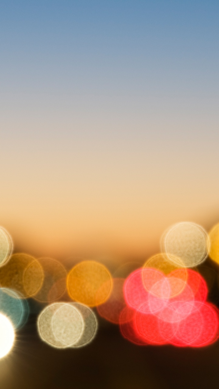 Gelbe Und Blaue Bokeh-Lichter. Wallpaper in 720x1280 Resolution