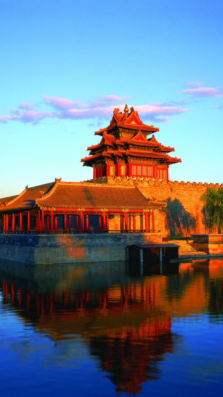 Brown and Black Temple Near Lake Under Blue Sky During Daytime. Wallpaper in 750x1334 Resolution