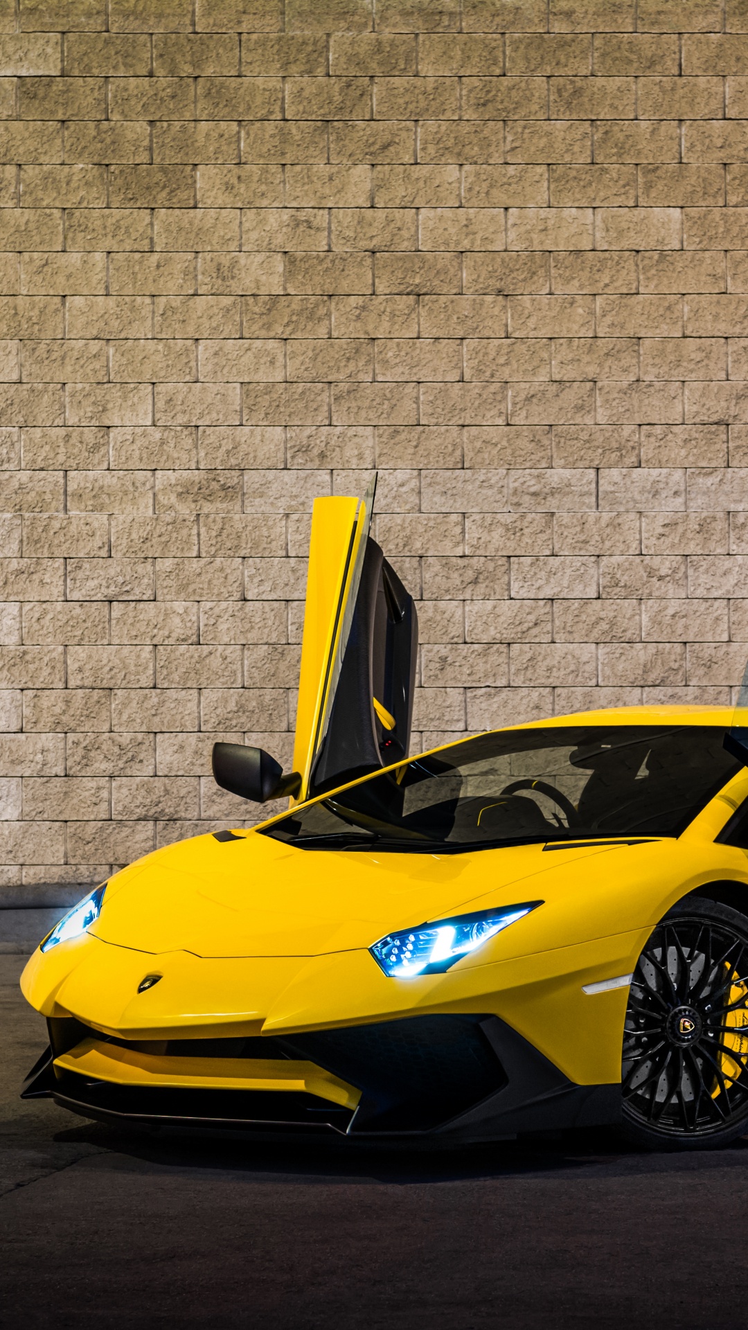 Yellow Ferrari 458 Italia Parked Beside Brown Brick Wall. Wallpaper in 1080x1920 Resolution