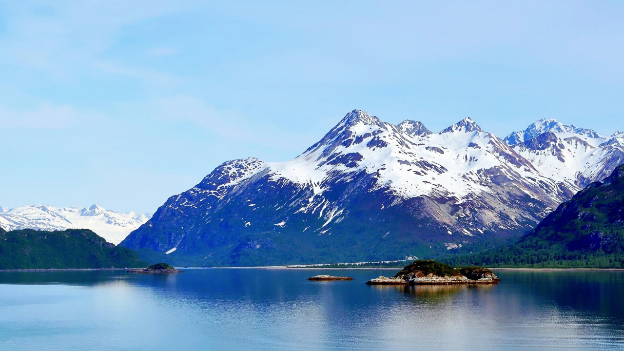 Snow Covered Mountain Near Lake During Daytime. Wallpaper in 1280x720 Resolution