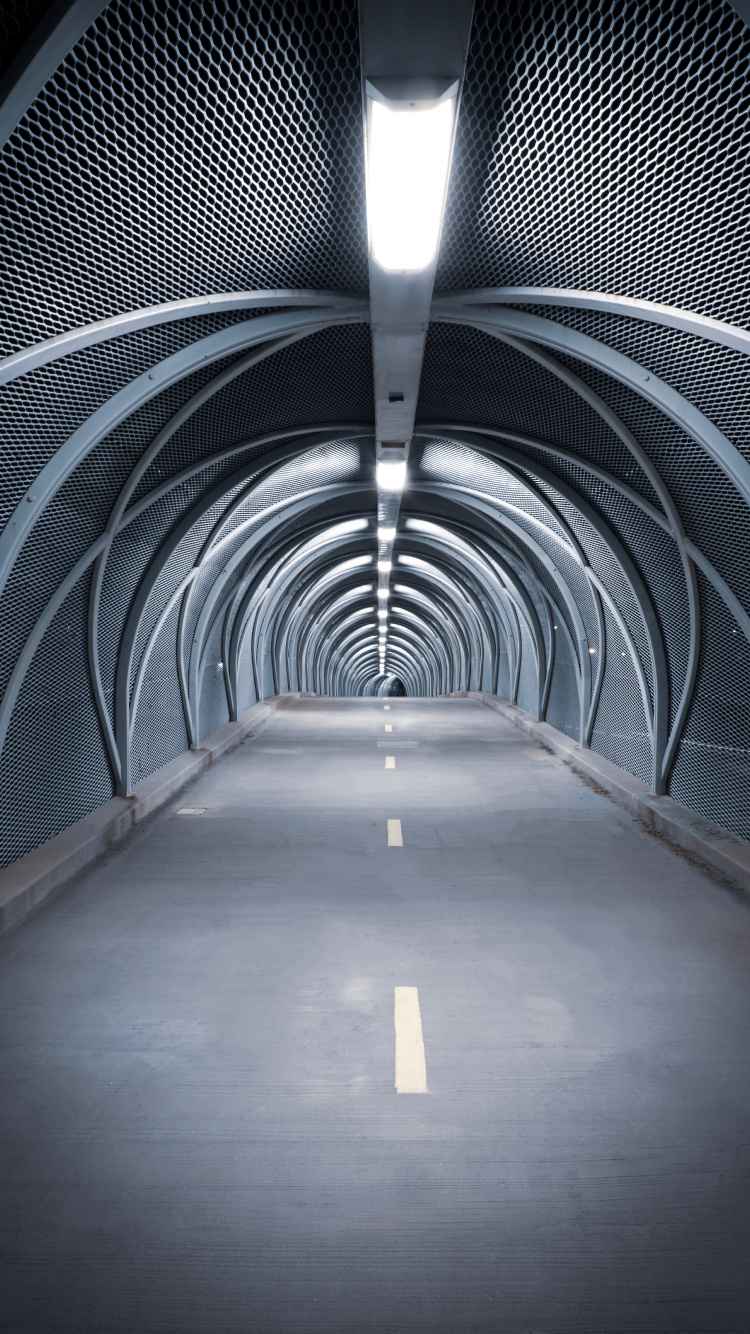 Brown Wooden Hallway With Blue Metal Railings. Wallpaper in 750x1334 Resolution