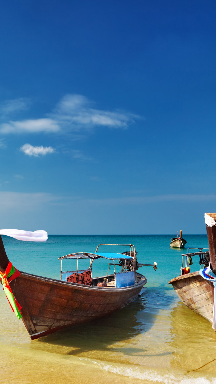 Brown Boat on Sea Shore During Daytime. Wallpaper in 750x1334 Resolution