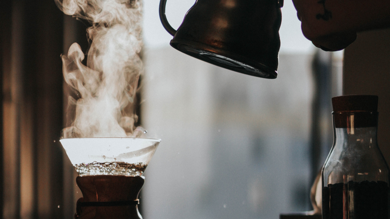 Person Pouring Water From Brown Ceramic Teapot to Clear Glass Pitcher. Wallpaper in 1366x768 Resolution